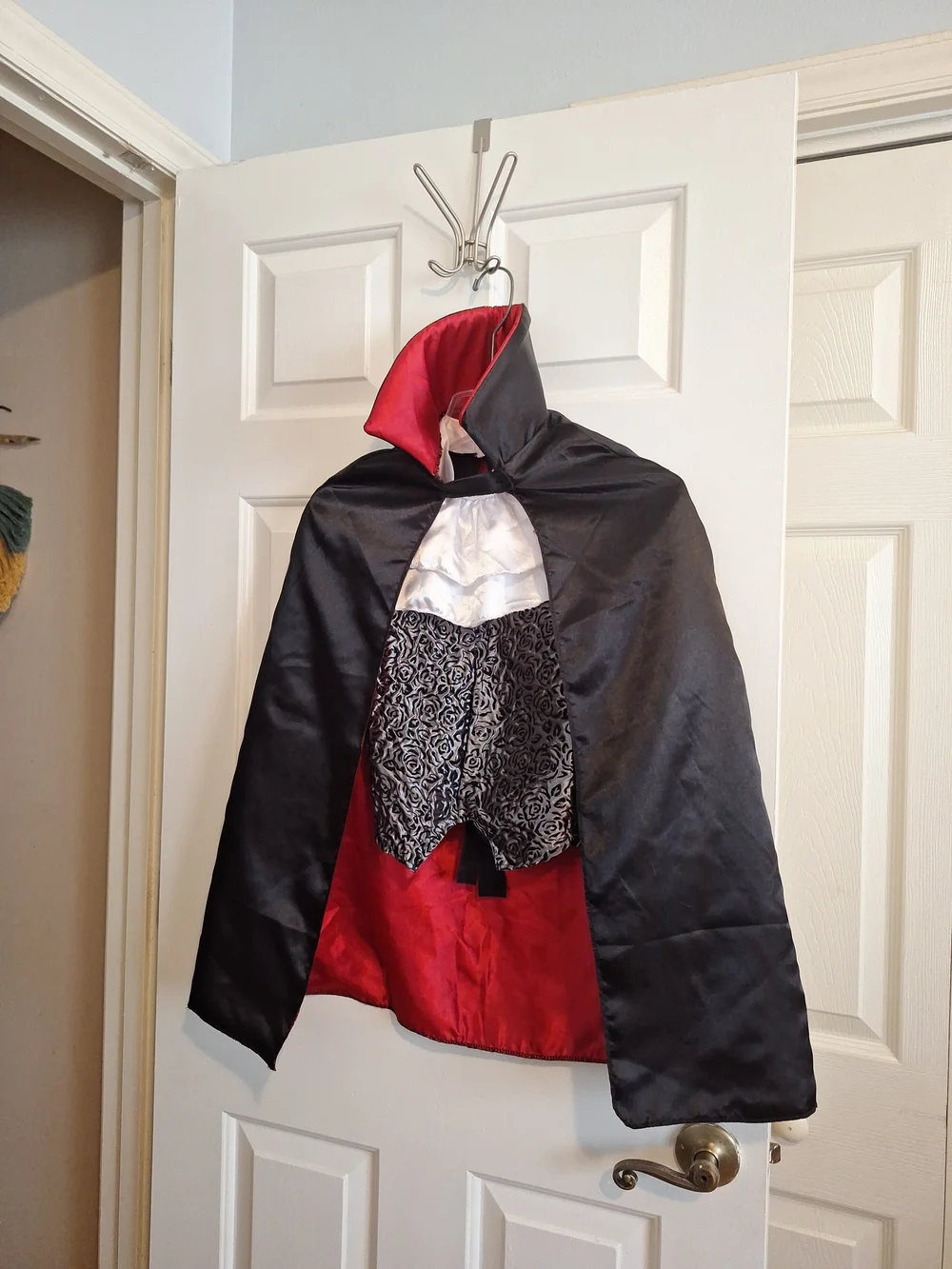 Spirit Black Cape with Red Satin Lining and Silver-Patterned Front